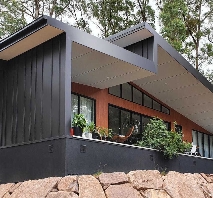 Blinker House' by Alchemy Architecture. Profile: LYSAGHT LONGLINE 305®. Walling: COLORBOND® steel cladding in the colour Night Sky®. Architect: Alchemy Architecture. Photographer: Luc Redmond. Builder & Trades: Enter Building Group