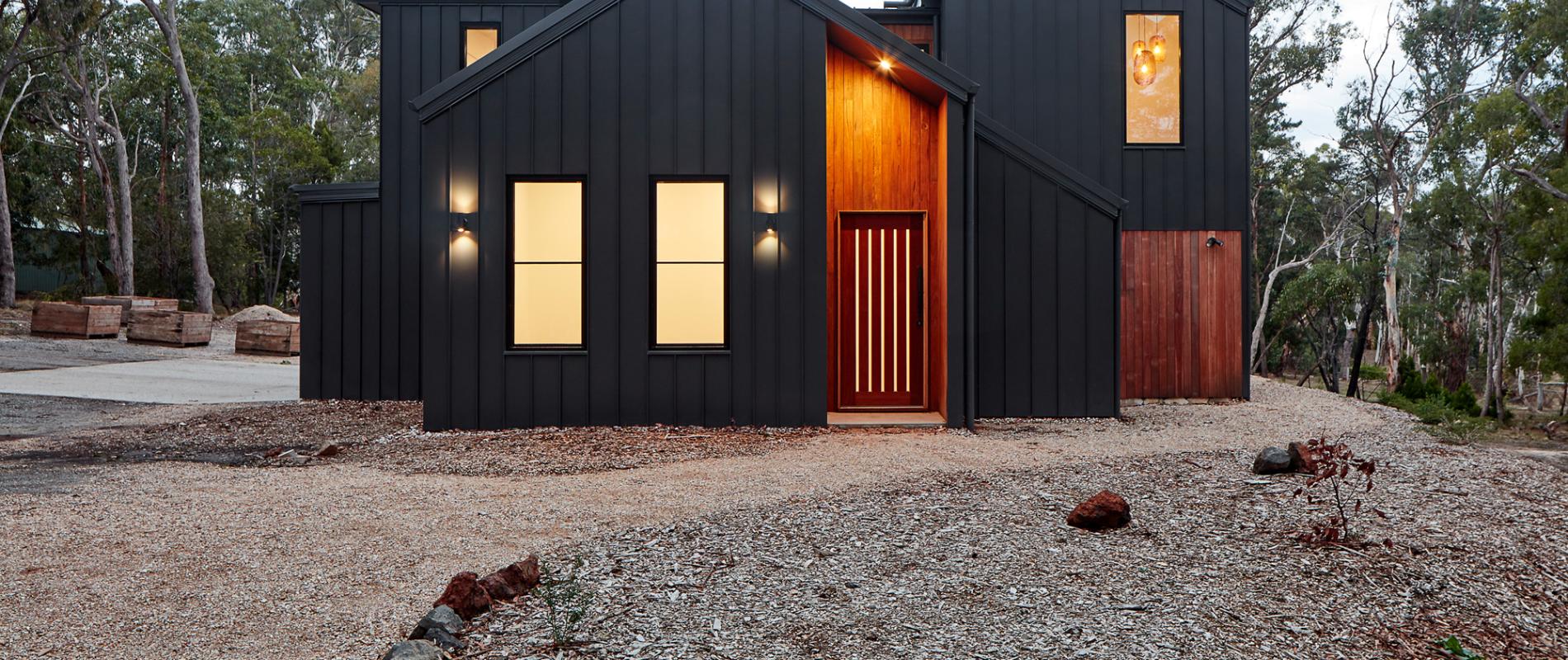 Double Happiness' by Glow Design Group. COLORBOND® steel Monument® Matt in the profiles LYSAGHT KLIP-LOK® (roofing) and LONGLINE 305® (cladding). Photo by: Jack Lovell. Designed by: Glow Design Group