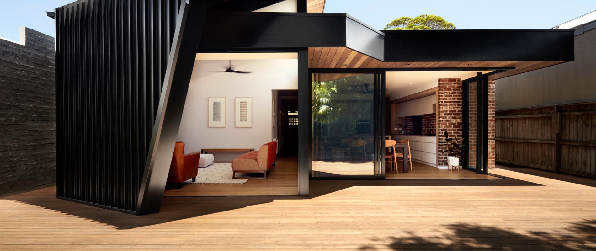 Blinker House' by Alchemy Architecture. Profile: LYSAGHT LONGLINE 305®. Walling: COLORBOND® steel cladding in the colour Night Sky®. Architect: Alchemy Architecture. Photographer: Luc Redmond. Builder & Trades: Enter Building Group