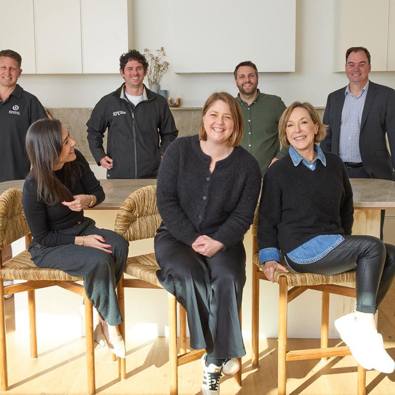 Steel The Show - Grand Prize Winners - Melinda and Building suppliers sitting in a kitchen with BlueScope representatives Sarah Stephenson and Aneta Pyzel 