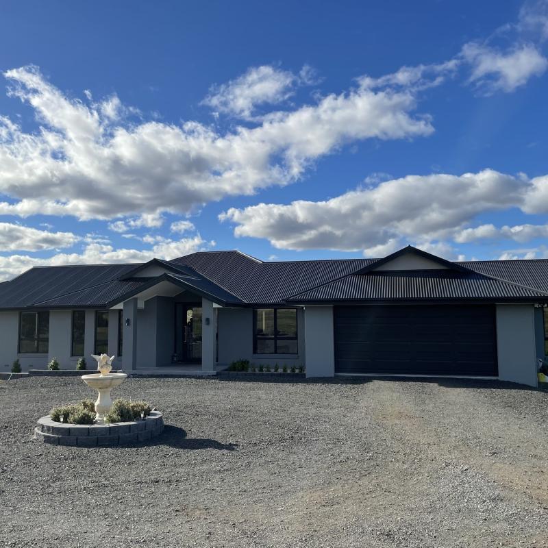 Jarrod from Brighton, TAS loves COLORBOND® steel. Roofing, Guttering & Fascia, Garage Doors, Sheds made from COLORBOND® steel in colour Monument® and Windspray®