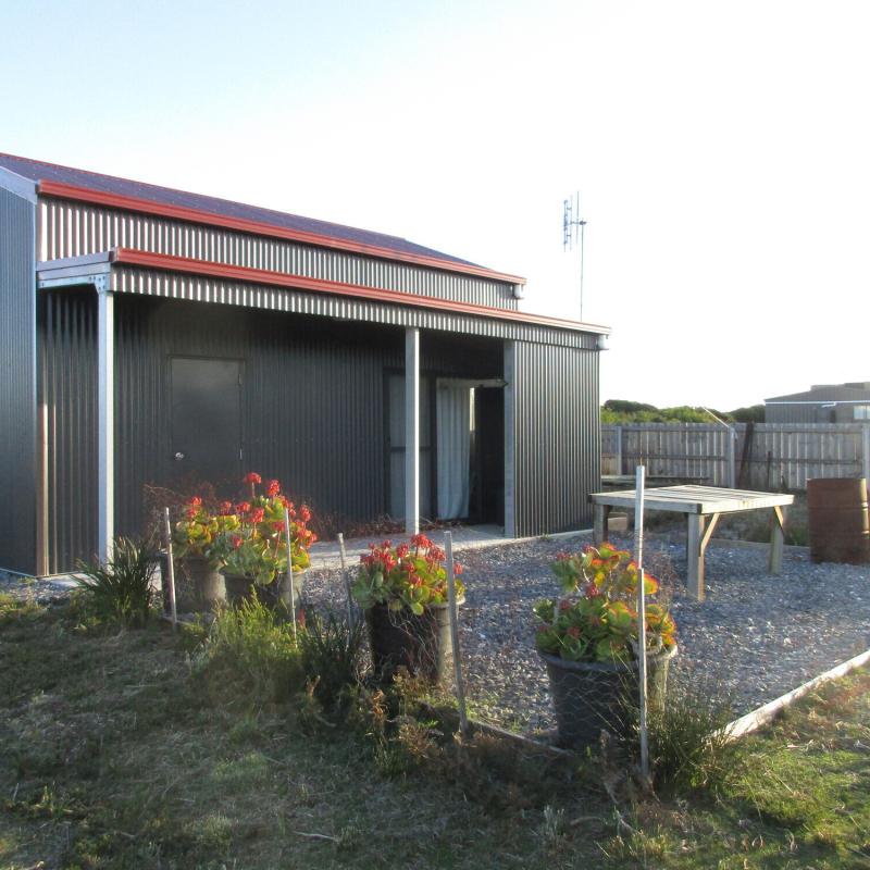 Veronica from Lulworth, TAS loves COLORBOND® steel. Roofing, Guttering & Fascia, Garage Doors, Sheds, Patio & Pergola made from COLORBOND® steel in colours Manor Red® and Monument® Matt