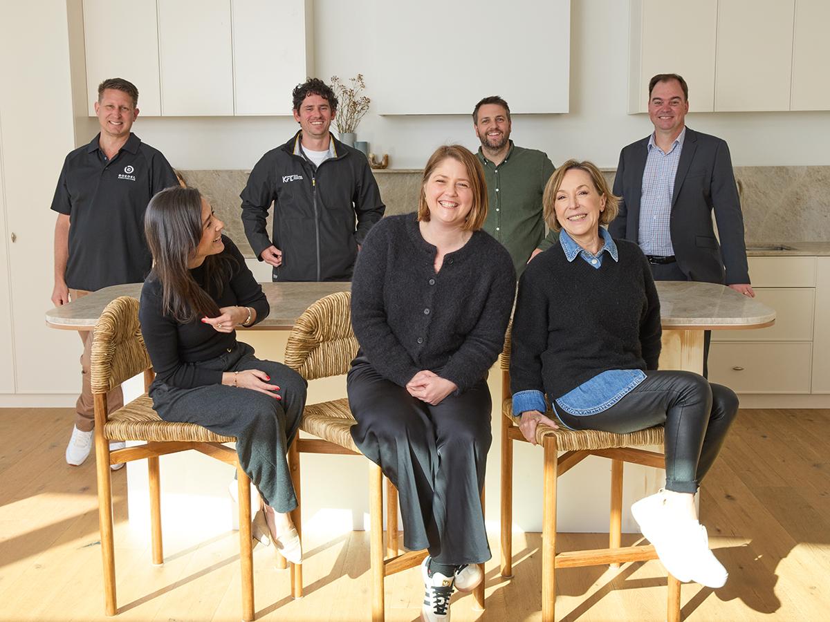 Steel The Show - Grand Prize Winners - Melinda and Building suppliers sitting in a kitchen with BlueScope representatives Sarah Stephenson and Aneta Pyzel 